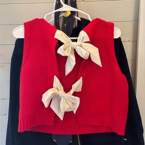Super cute red sweater vestter with bows